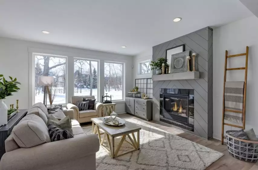 Modern farmhouse living room with grey fireplace