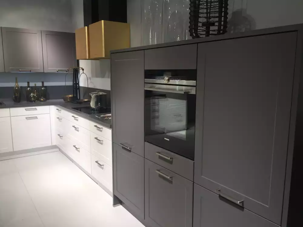 Modern kitchen with dark grey color and gold vent