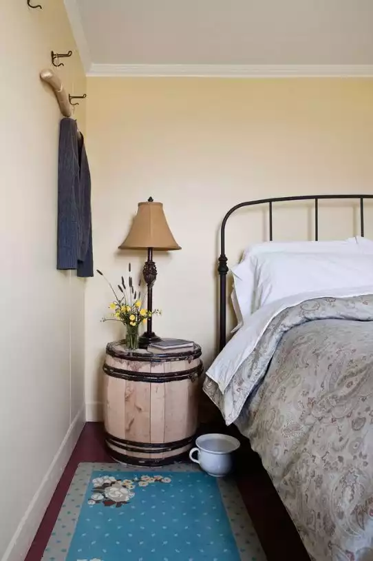 A cute barrel repurposed into a nightstand 