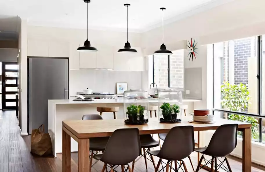 Open space kitchen with some terrariums on top