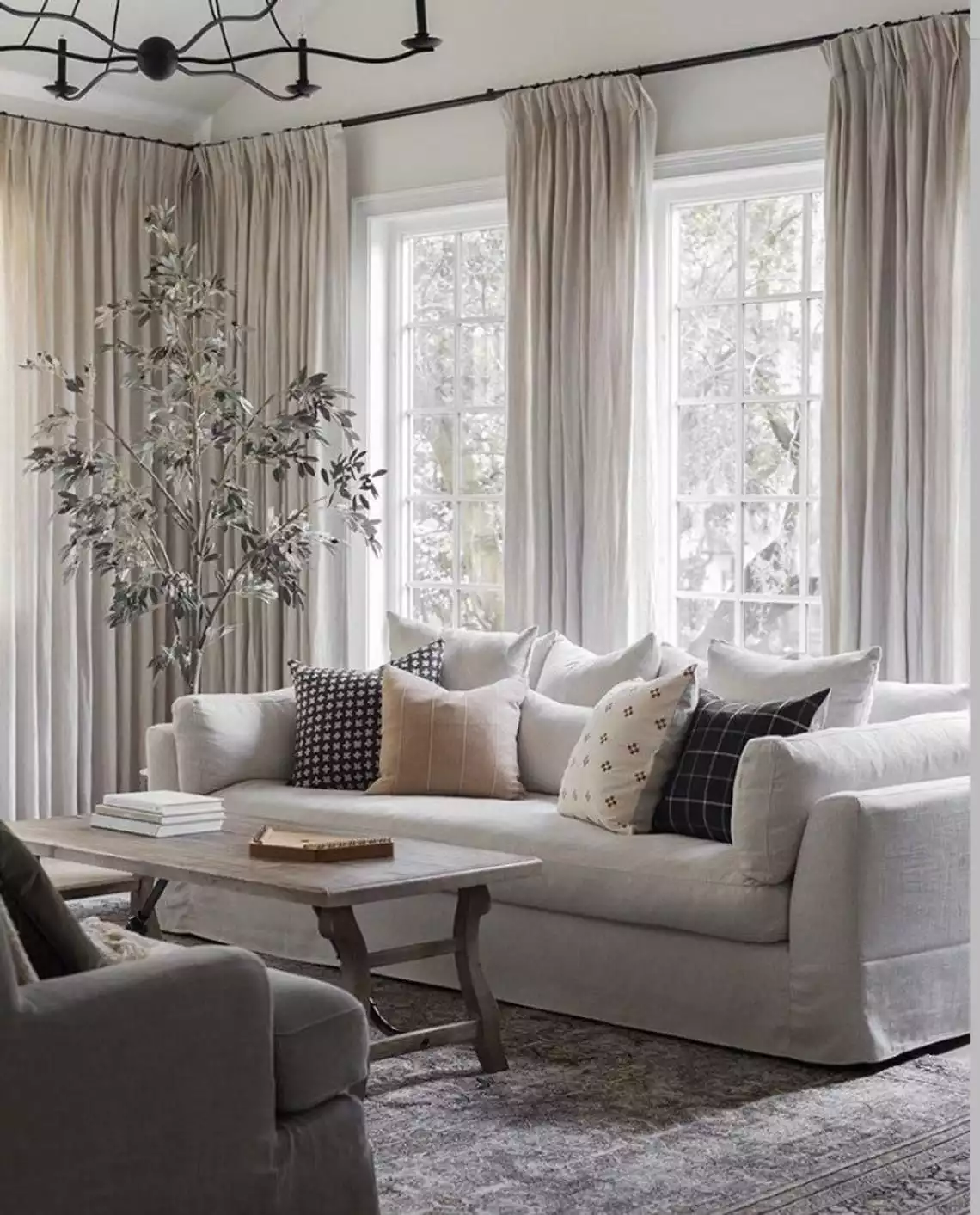 Panel Curtains Hung Above the Window Frame