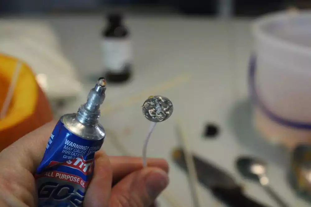 Put a little super glue onto the bottom