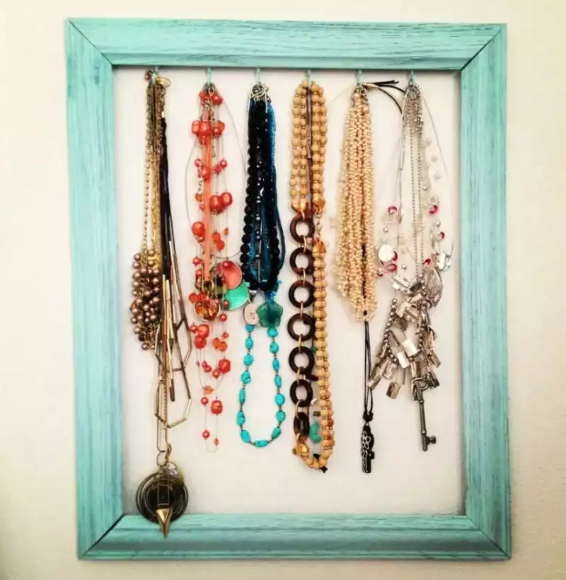 Repurposed frame organizer for necklaces