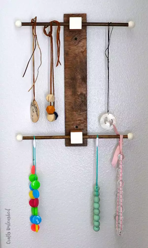 Sculptural necklace holder made of wood