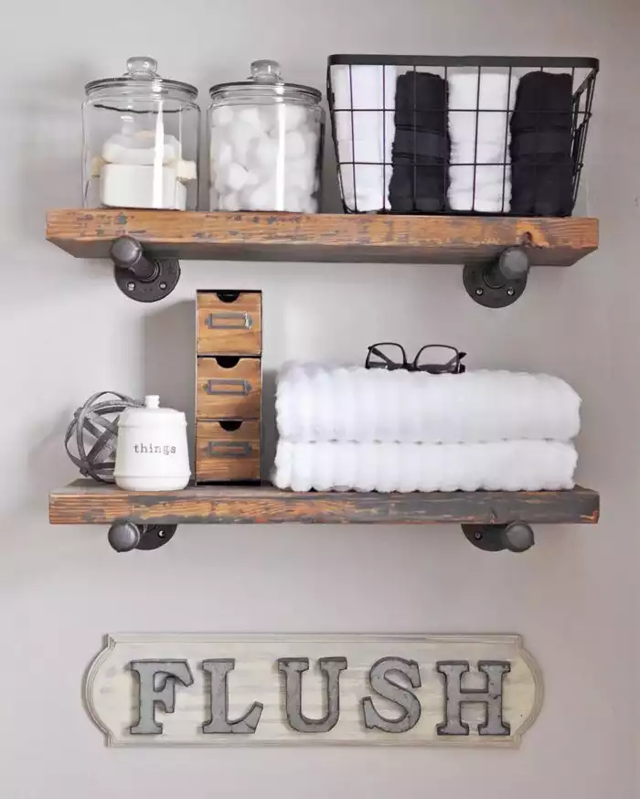 Shelves above the toilet with a farm inspired design