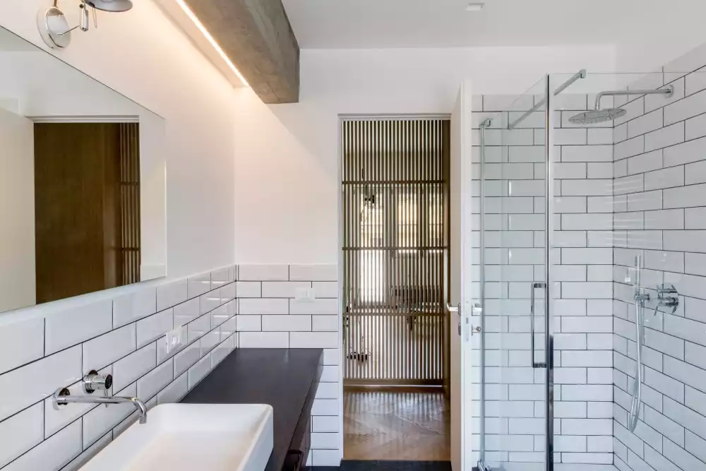 Small subway tiles walk in shower