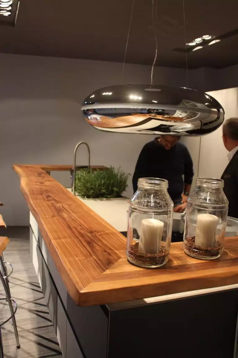 A live edge slab of wood adds style beyond compare in this Spagnol kitchen