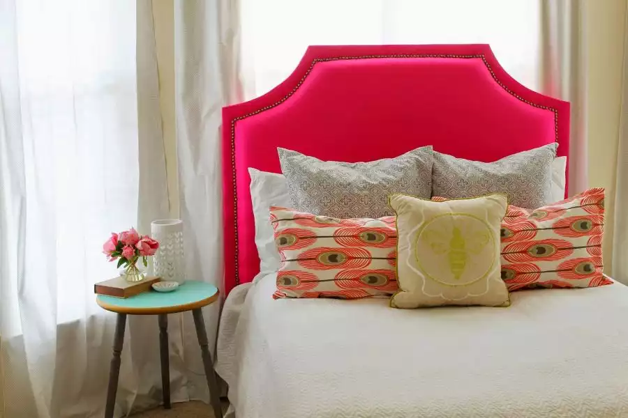 Upholstered headboard with a thumbtack trim