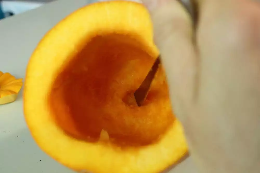 Use a spoon end or something similar