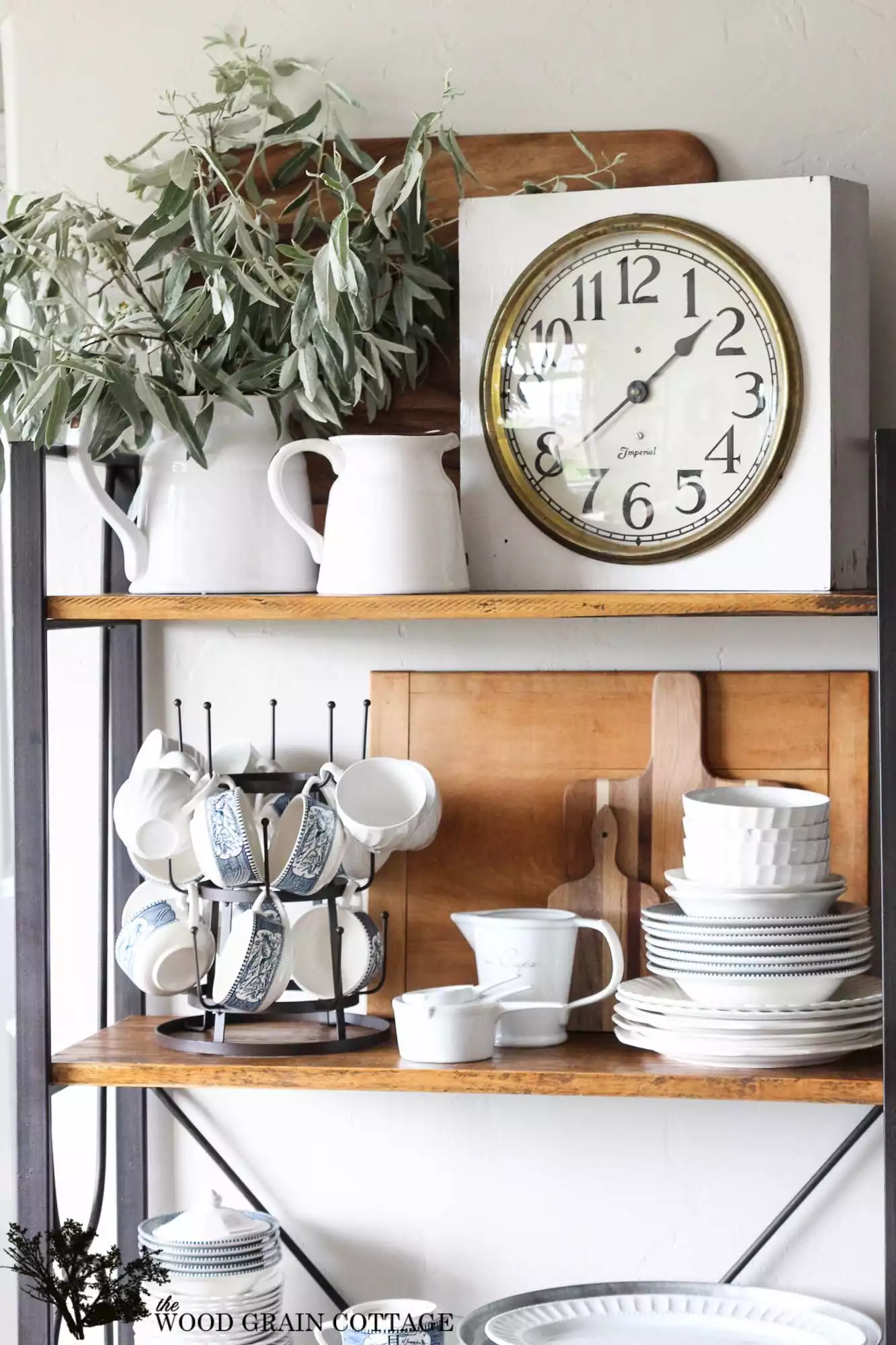 Vintage kitchen clock on shelves