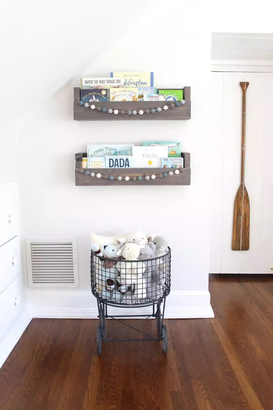 Simple wood shelves with cute pom-pom garlands