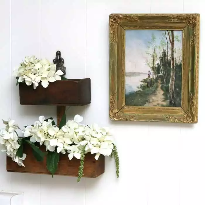 Flower display shelves made of repurposed wood boxes