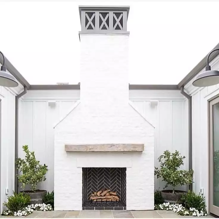 White Paint On Brick Can Enhance An Exterior Fireplace