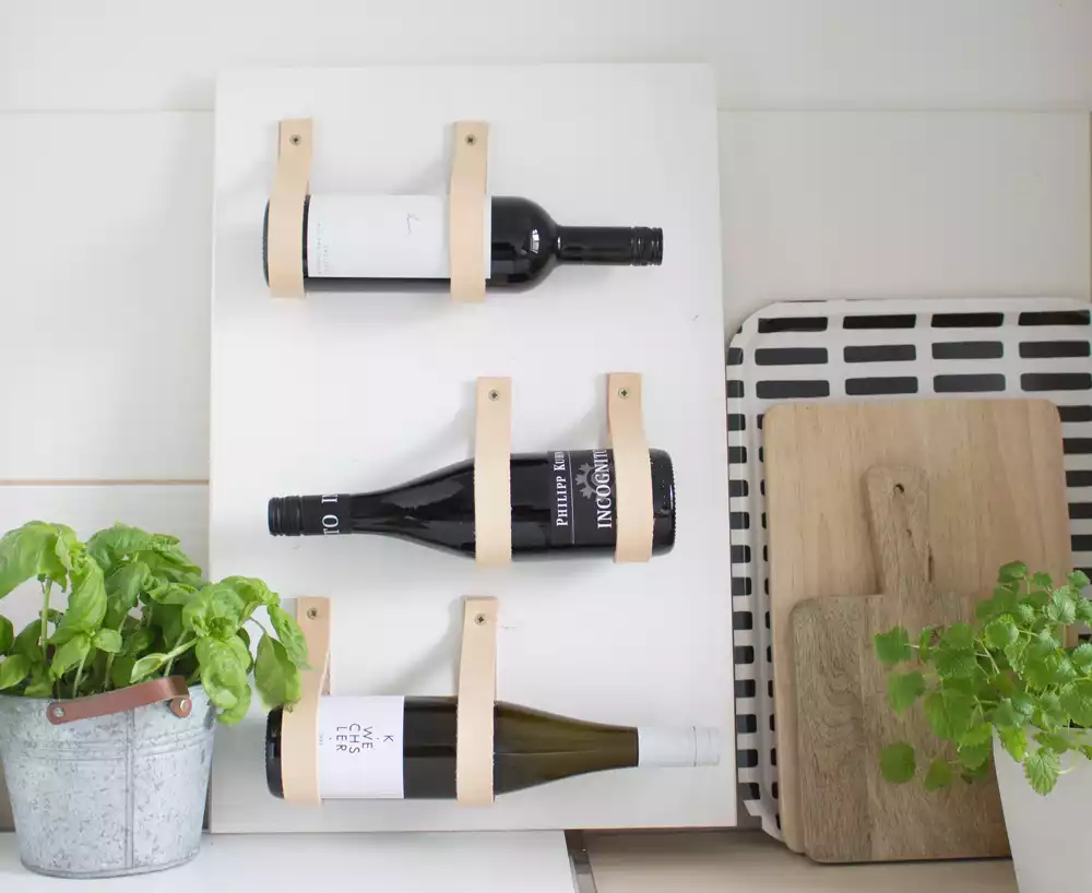 Wine rack with leather straps