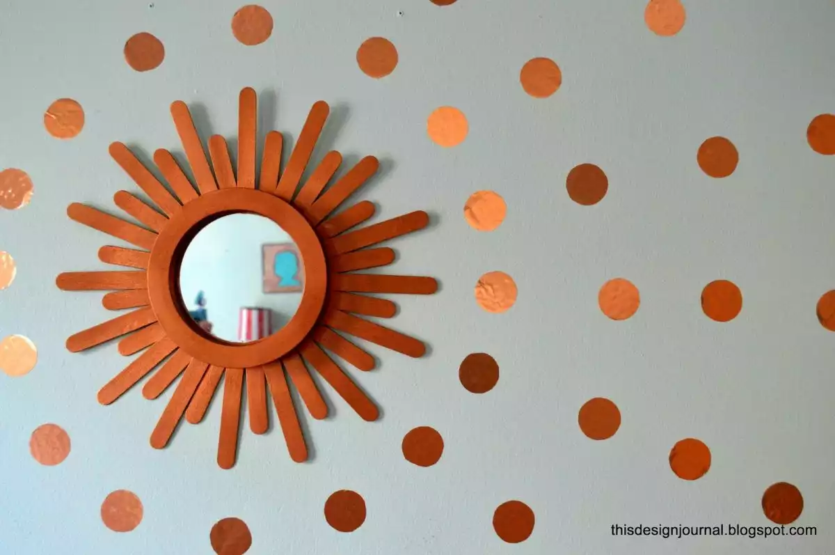 Wood craft sticks to create a sunburst mirror