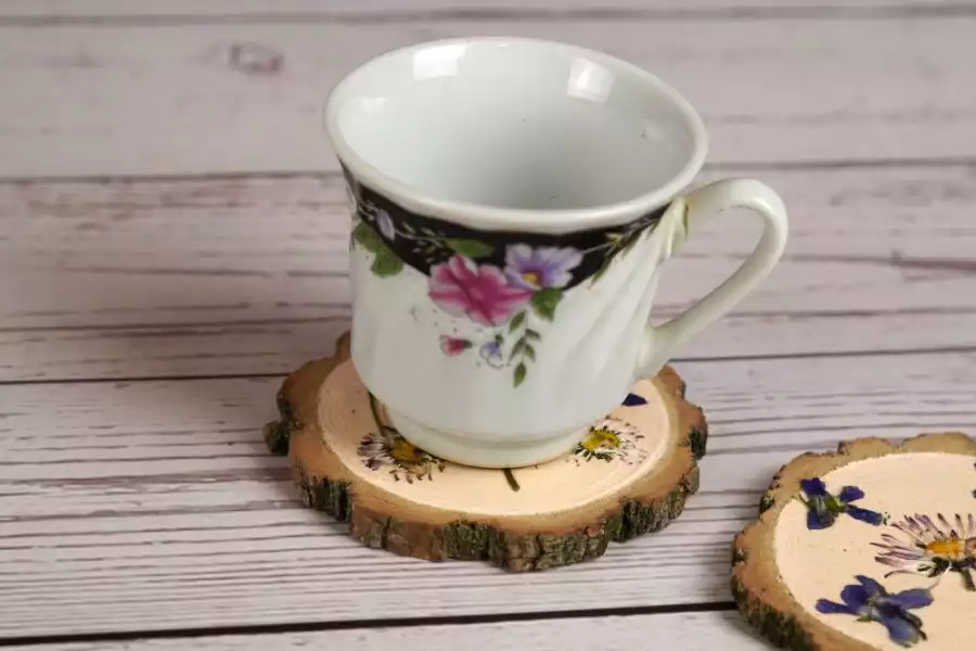 Wooden coasters decorated with pressed flowers