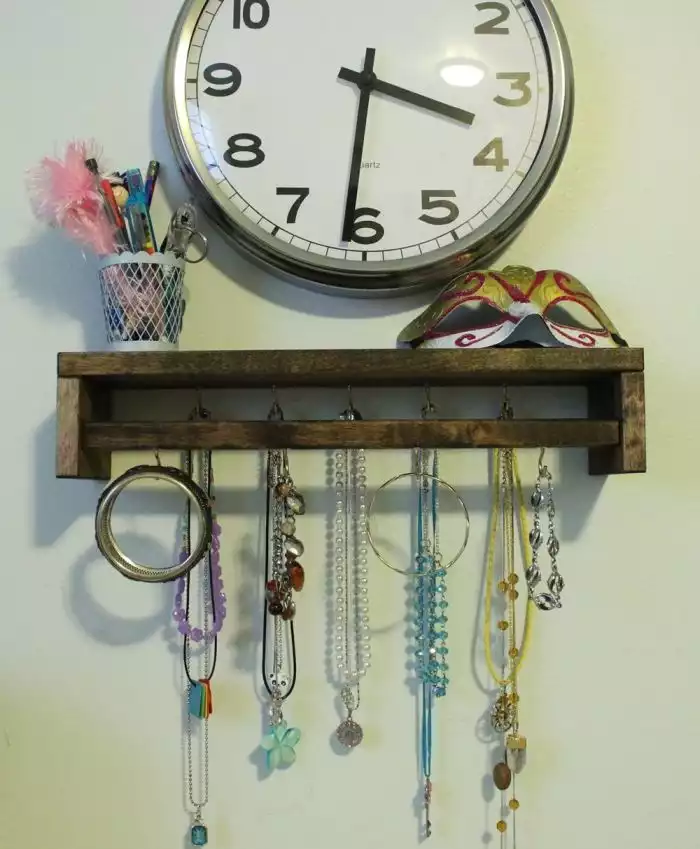 Wooden spice rack repurposed into a jewelry organizer