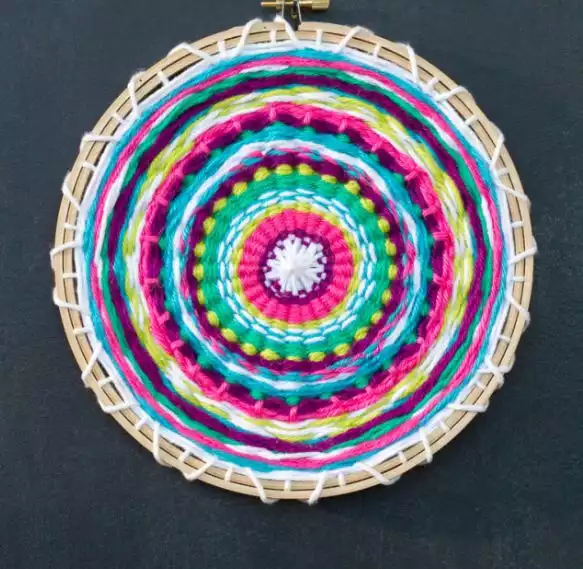 A colorful weaving loom using assorted yarn