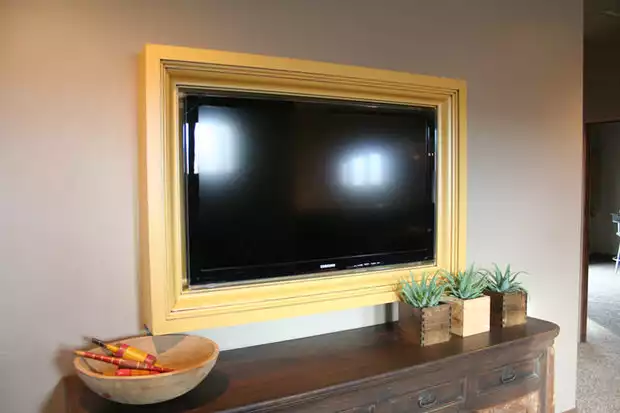 Yellow wall mounted frame tv