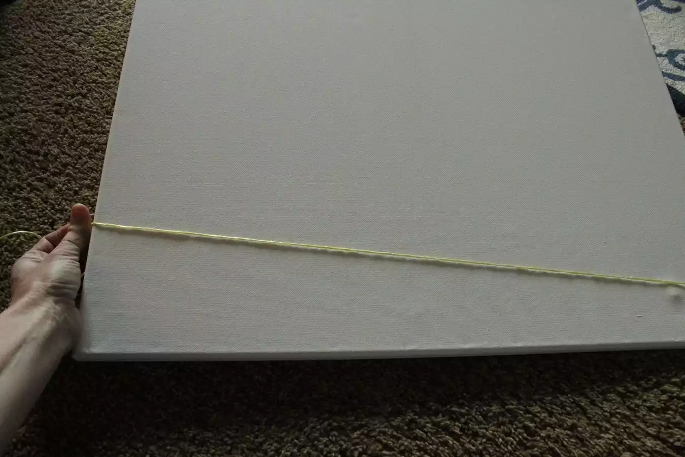 Step 1: Tape down end of string