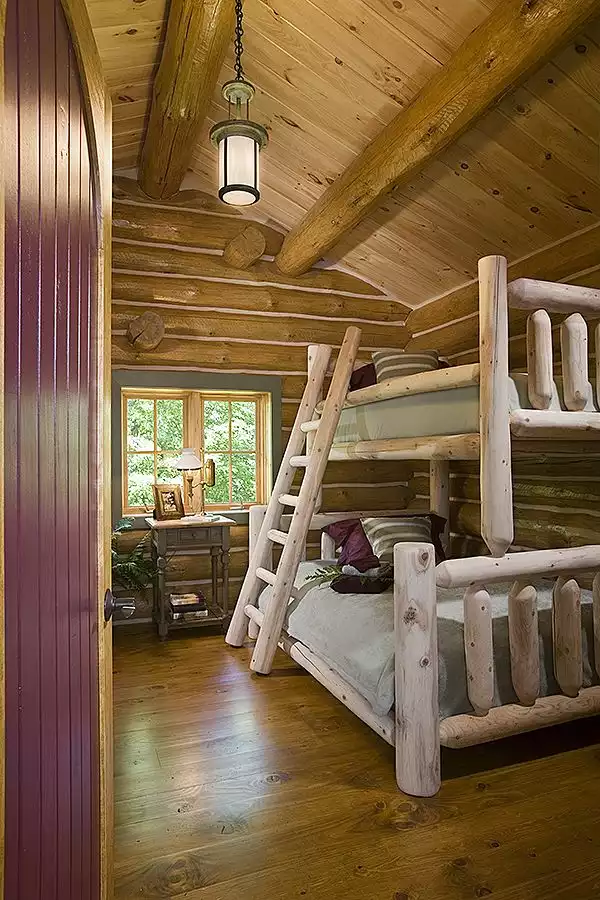 Bed and ladder from wood logs