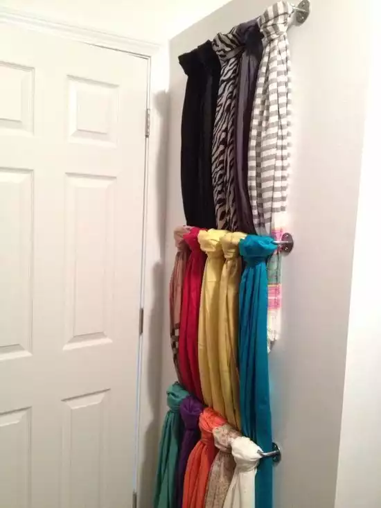 behind closet door scarf holding