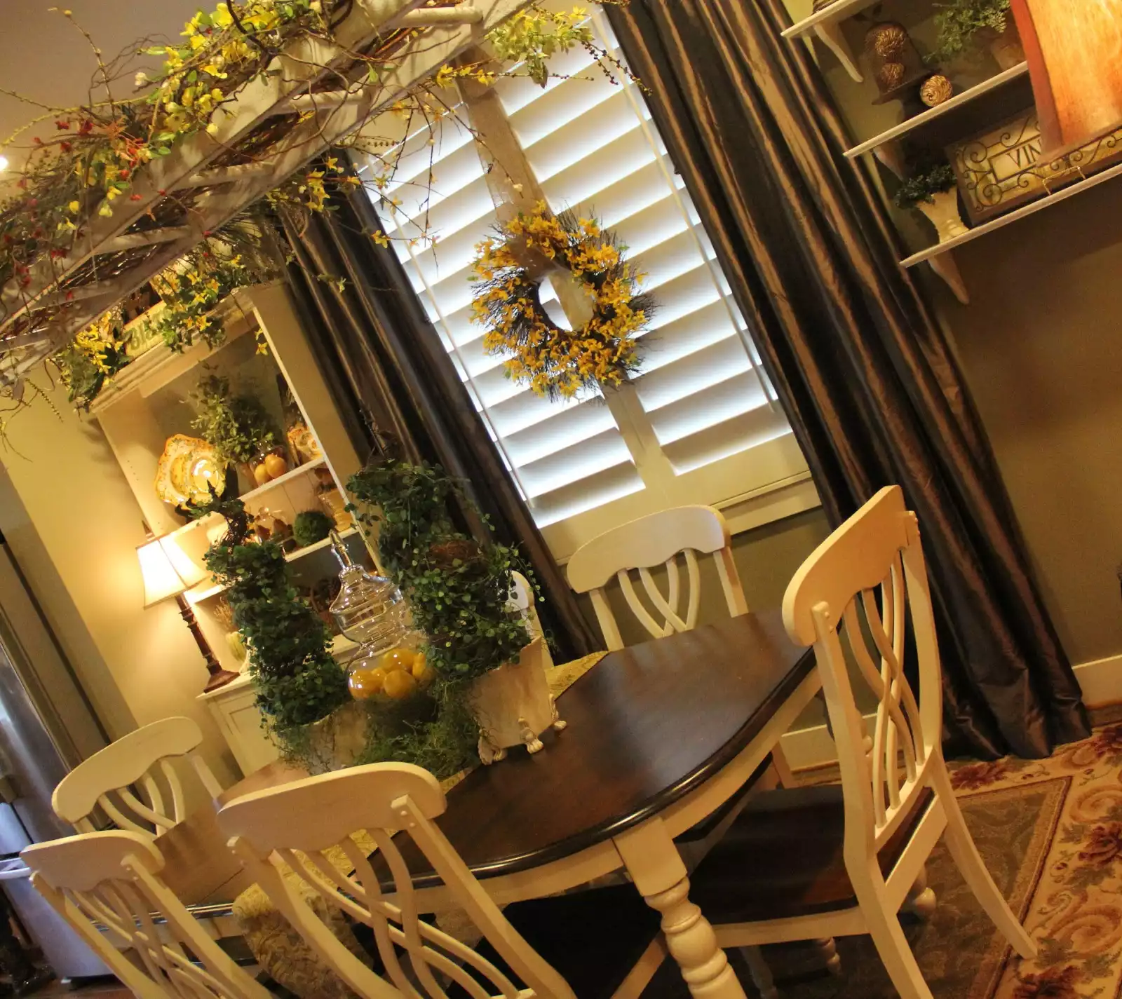 dining room with ladder above the table