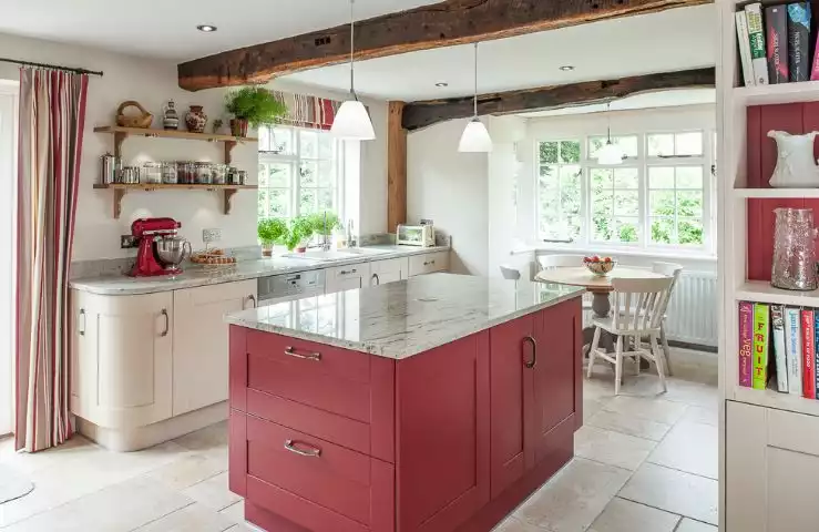 fuschia kitchen design with wooden beams