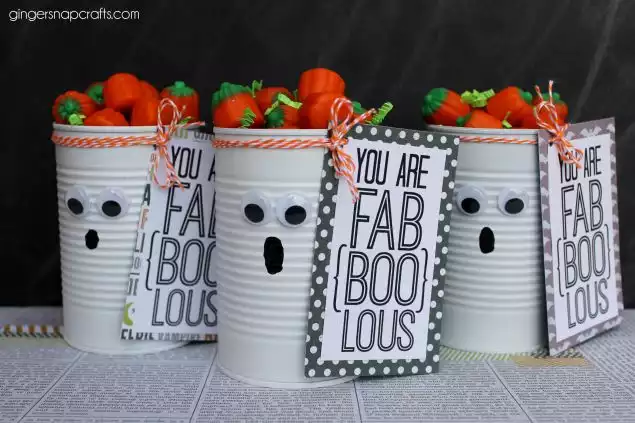googly eyes on tin cans