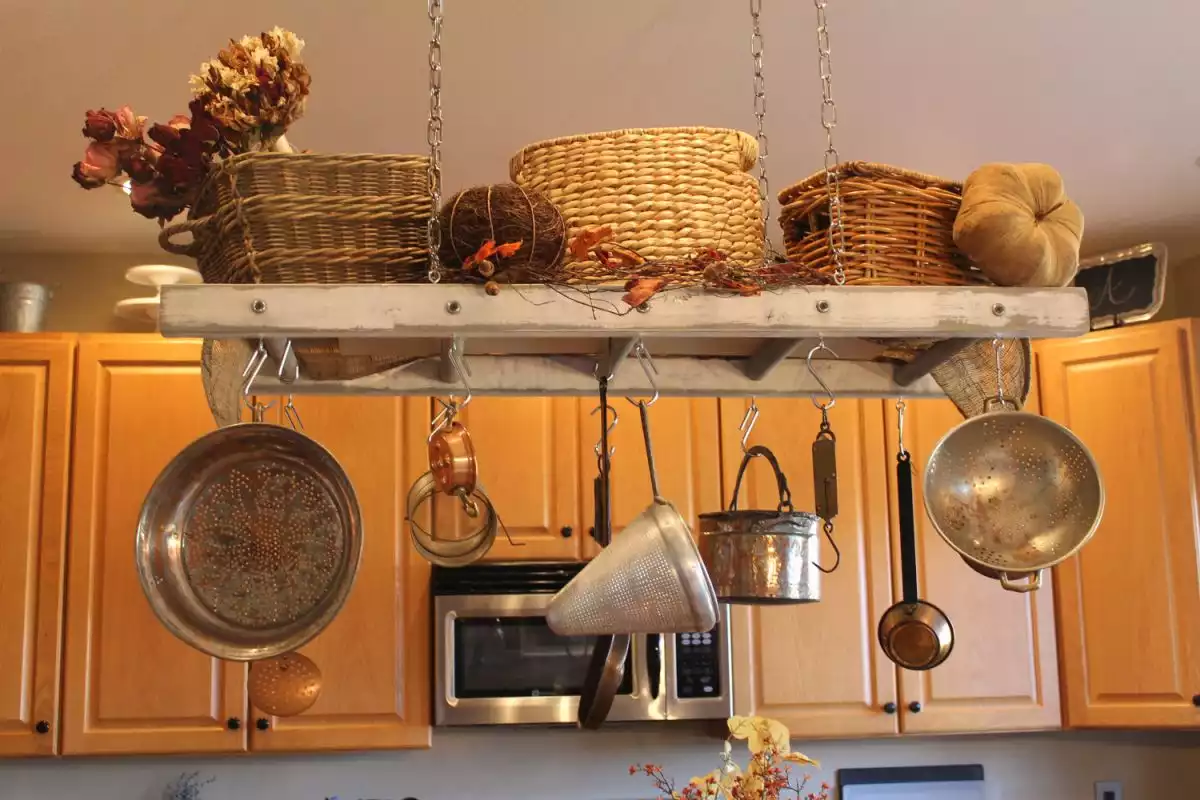 gray ladder above the kitchen island storage