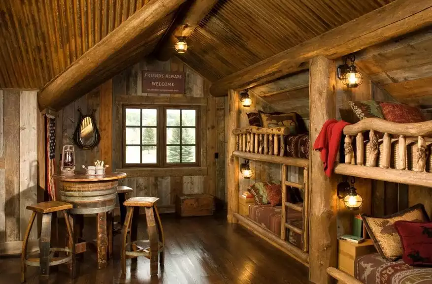 Mountain room with bunk beds and half barrel table