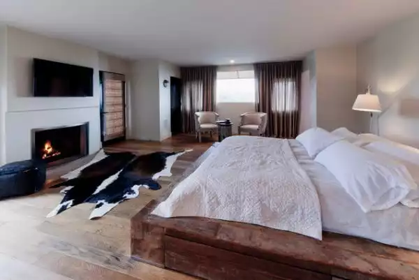 Rustic bedroom cowhide rug