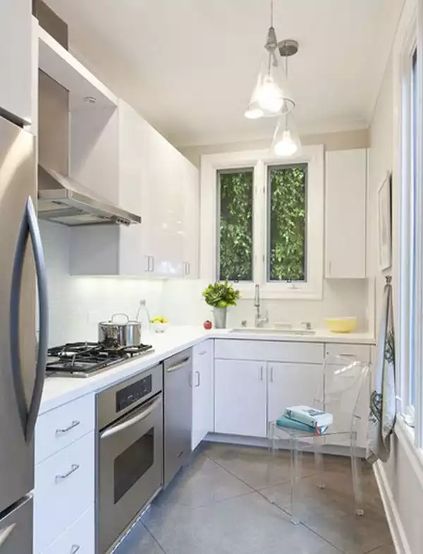 Small white kitchen well organized