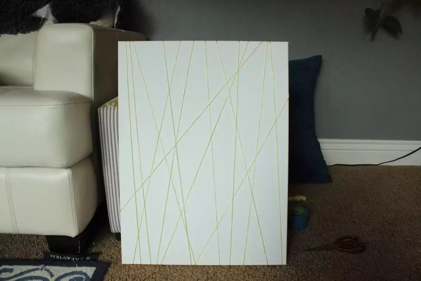 Step 3: Wrap string around back of canvas; repeat steps 2 & 3
