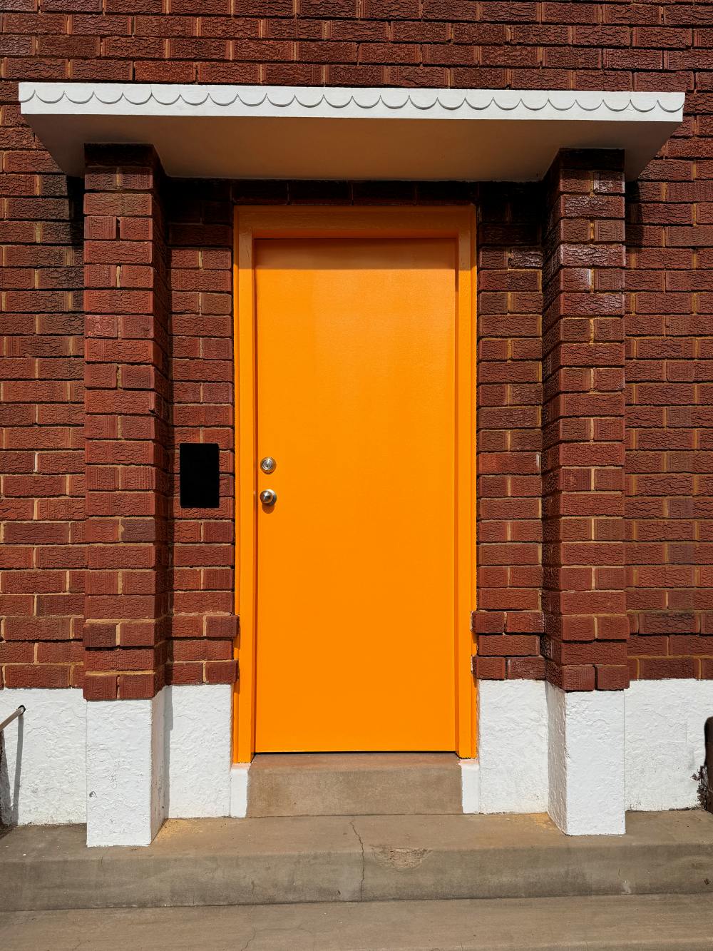 Orange front door color paint meaning